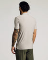 Light Heather Gray Short Sleeve Tall Active Polo worn by tattooed man.