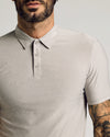 Man wearing Light Heather Gray Short Sleeve Tall Active Polo.