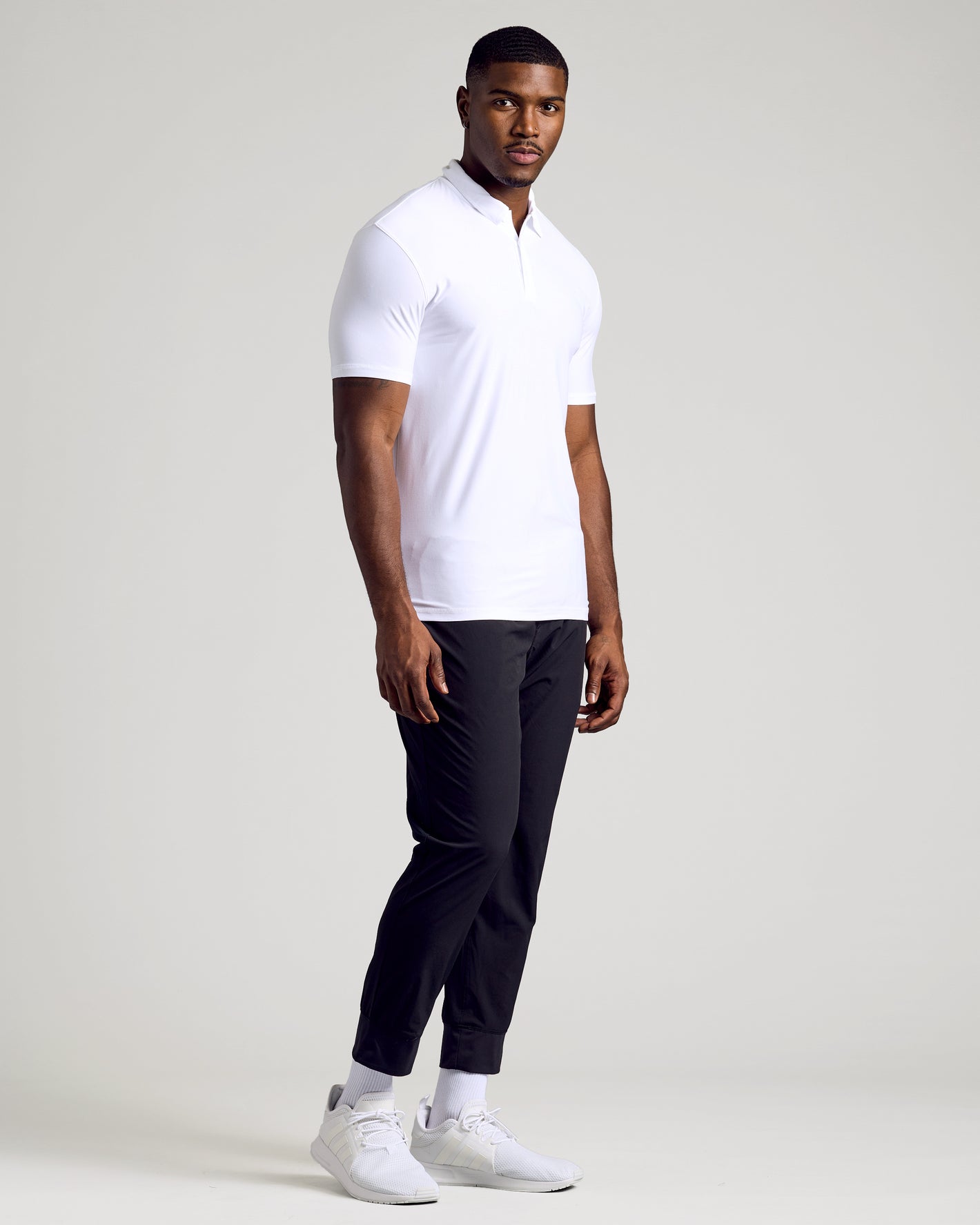 White Tall Active Polo 3-Pack on model, showcasing snug fit and style.