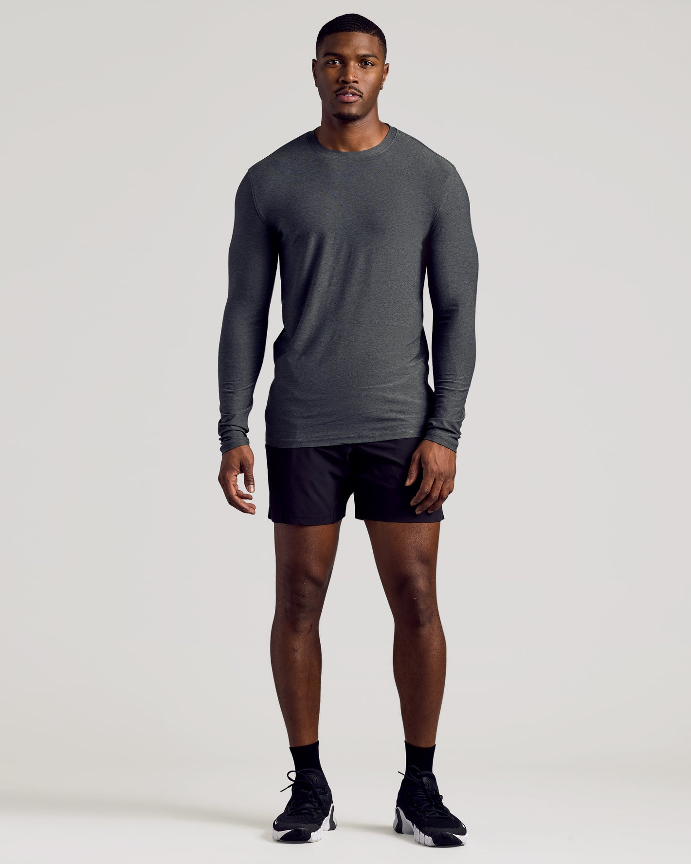 Man modeling Charcoal Heather Gray Long Sleeve Tall Active Crew.