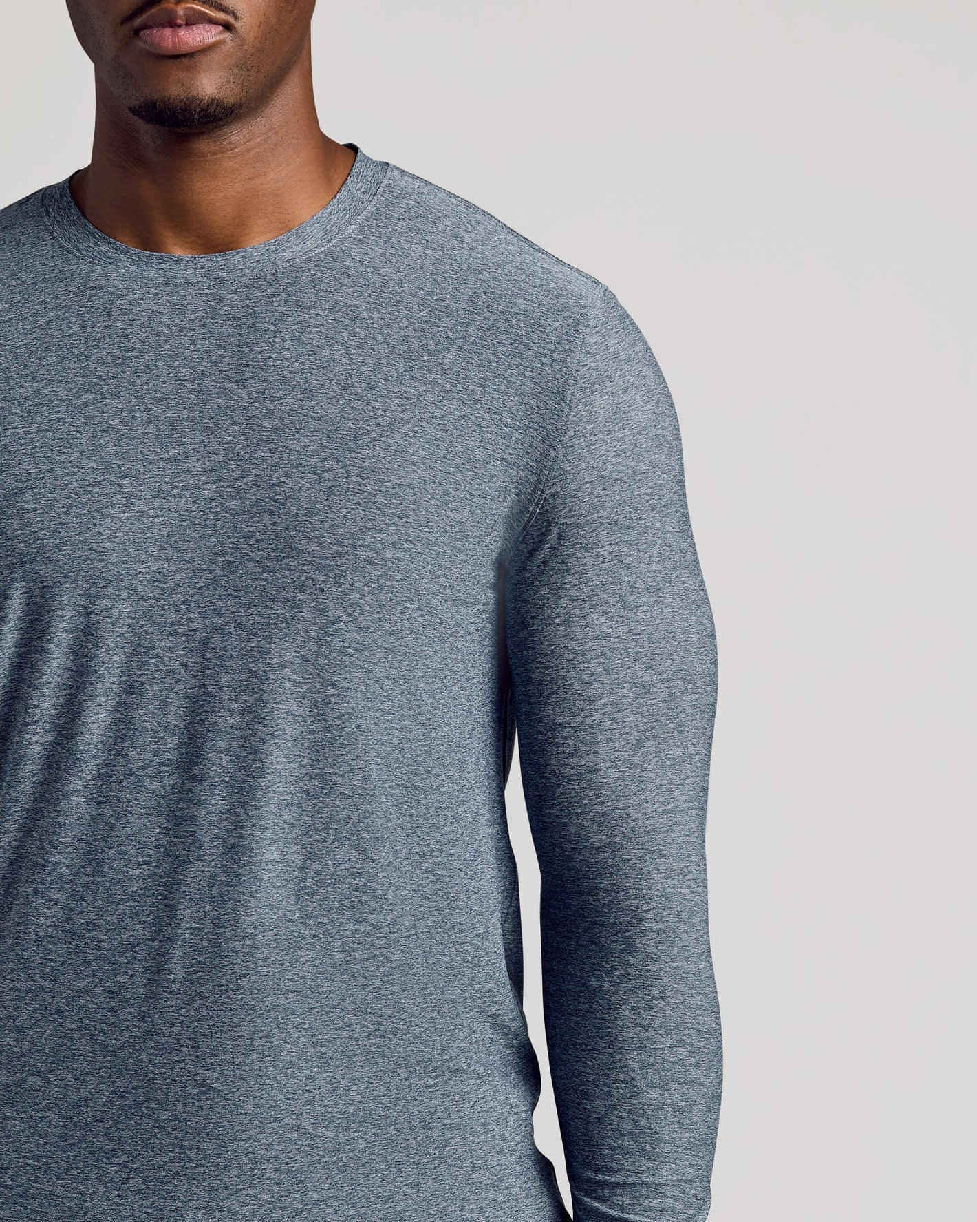 Heather Navy Long Sleeve Tall Active Crew on a man's upper body.