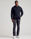 Man wears Black & Carbon Tall Waffle Hoodie 2-Pack with jeans and sneakers.