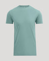 A short-sleeve crewneck t-shirt in a muted sage green color, displayed on a solid light gray background.