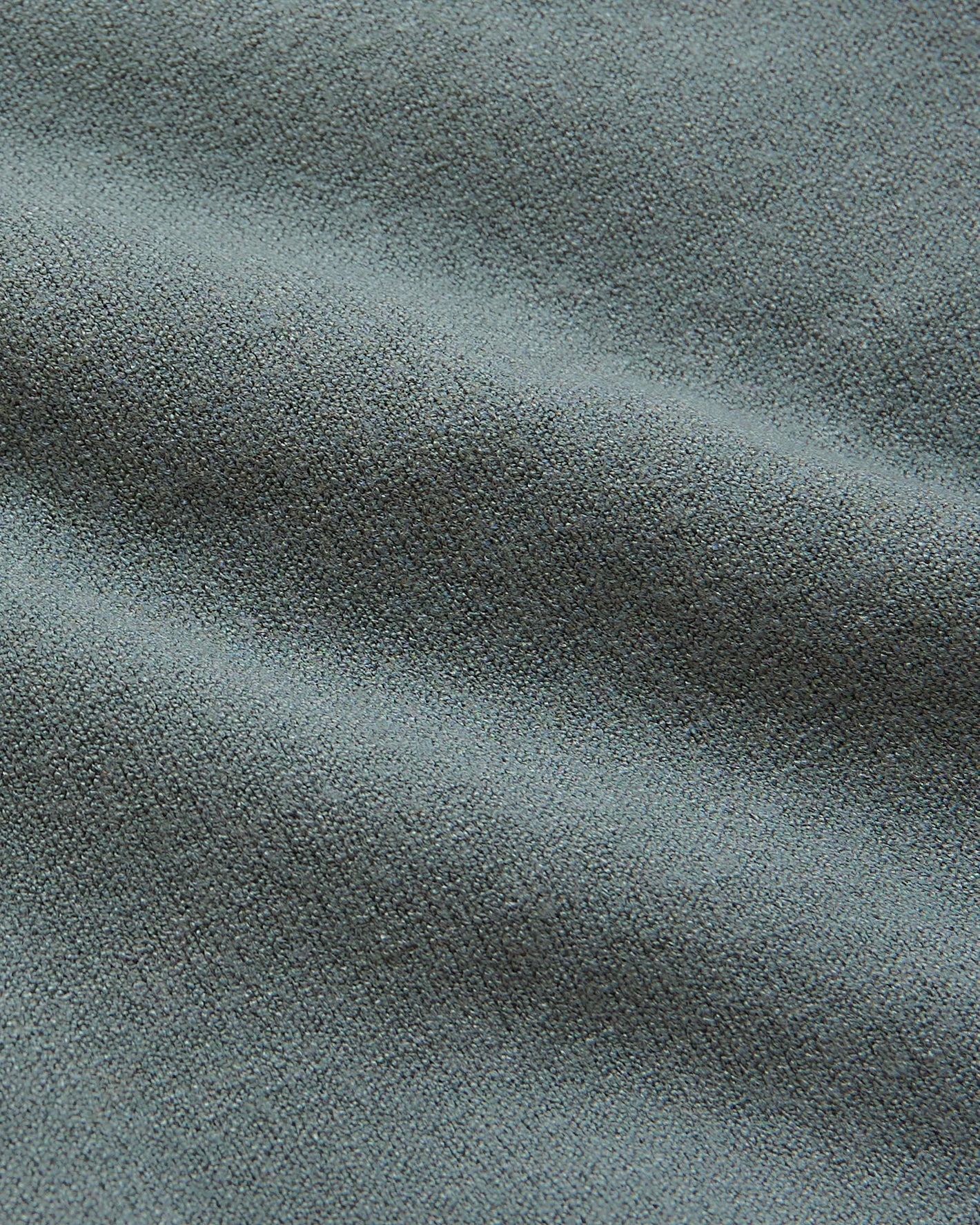 Moss Tall Dressy Polo fabric detail showing tightly woven texture.