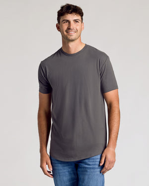 Young man wearing Carbon Short Sleeve Tall Curved Hem Crew and jeans.