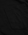 Black Tall Heavyweight Pocket Crew close-up, showcasing sturdy pocket stitching.