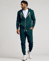 Man wearing Emerald Fleece French Terry Zip Hoodie with jogger pants.