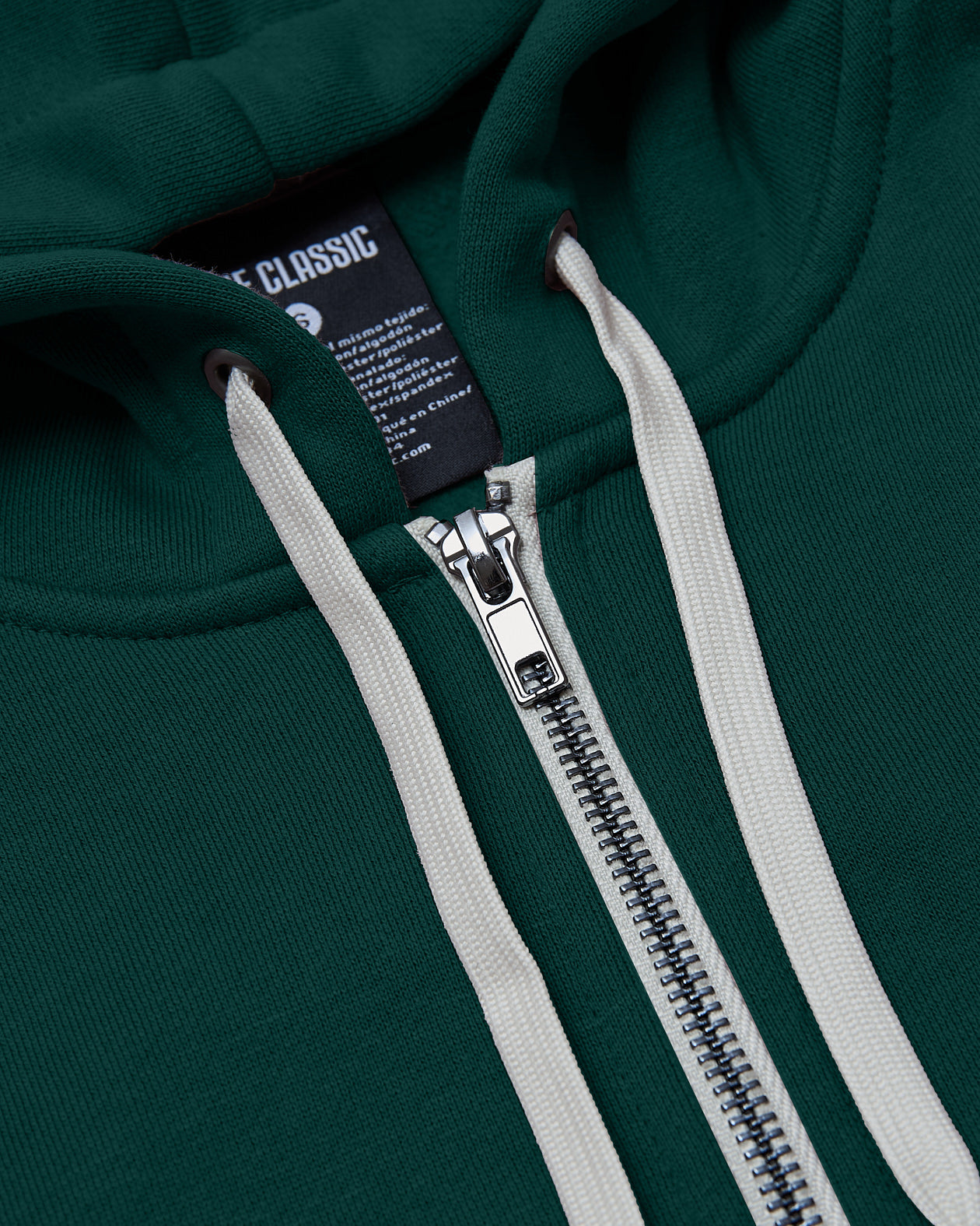Emerald Fleece French Terry Zip Hoodie with silver zipper and off-white drawstrings.