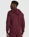 Man in Mahogany Fleece French Terry Zip Hoodie, hood down.