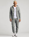 Man wearing Dark Heather Gray Fleece French Terry Zip Hoodie, relaxed stance.