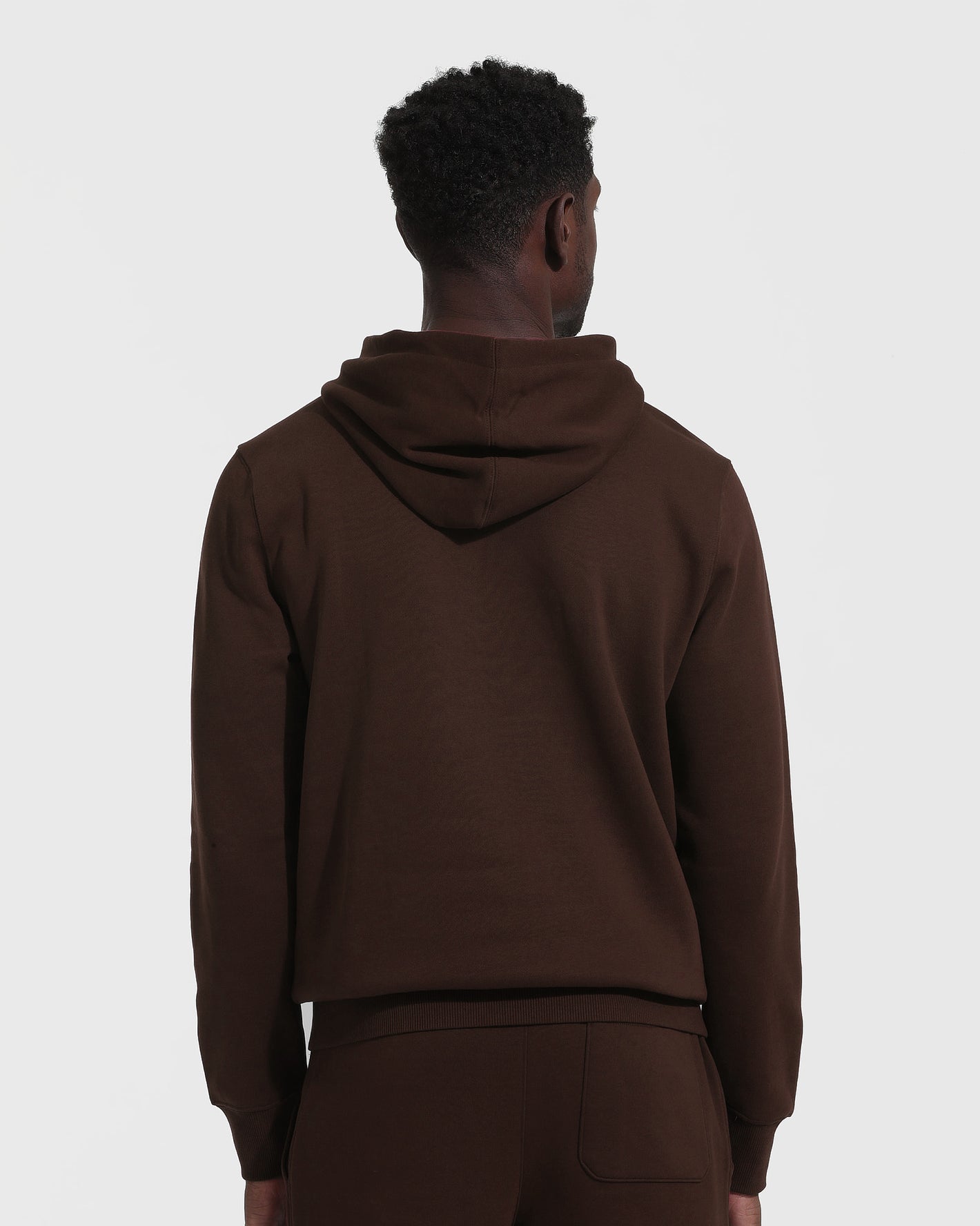 Dark Oak Fleece French Terry Pullover Hoodie from behind, worn with matching pants.