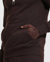Dark Oak Fleece French Terry Pullover Hoodie with ribbed hem and kangaroo pocket.