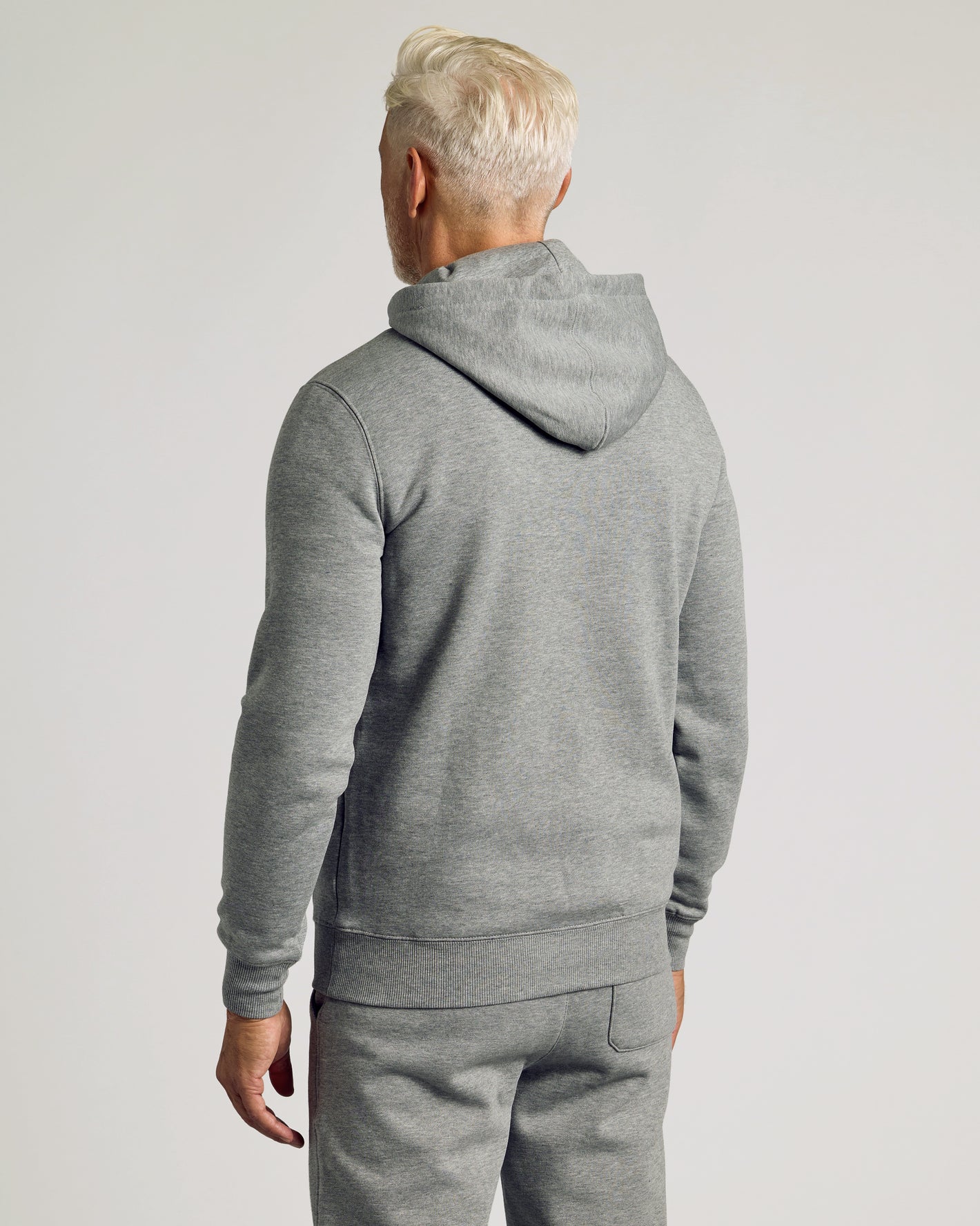 Person in Dark Heather Gray Fleece French Terry Pullover Hoodie.