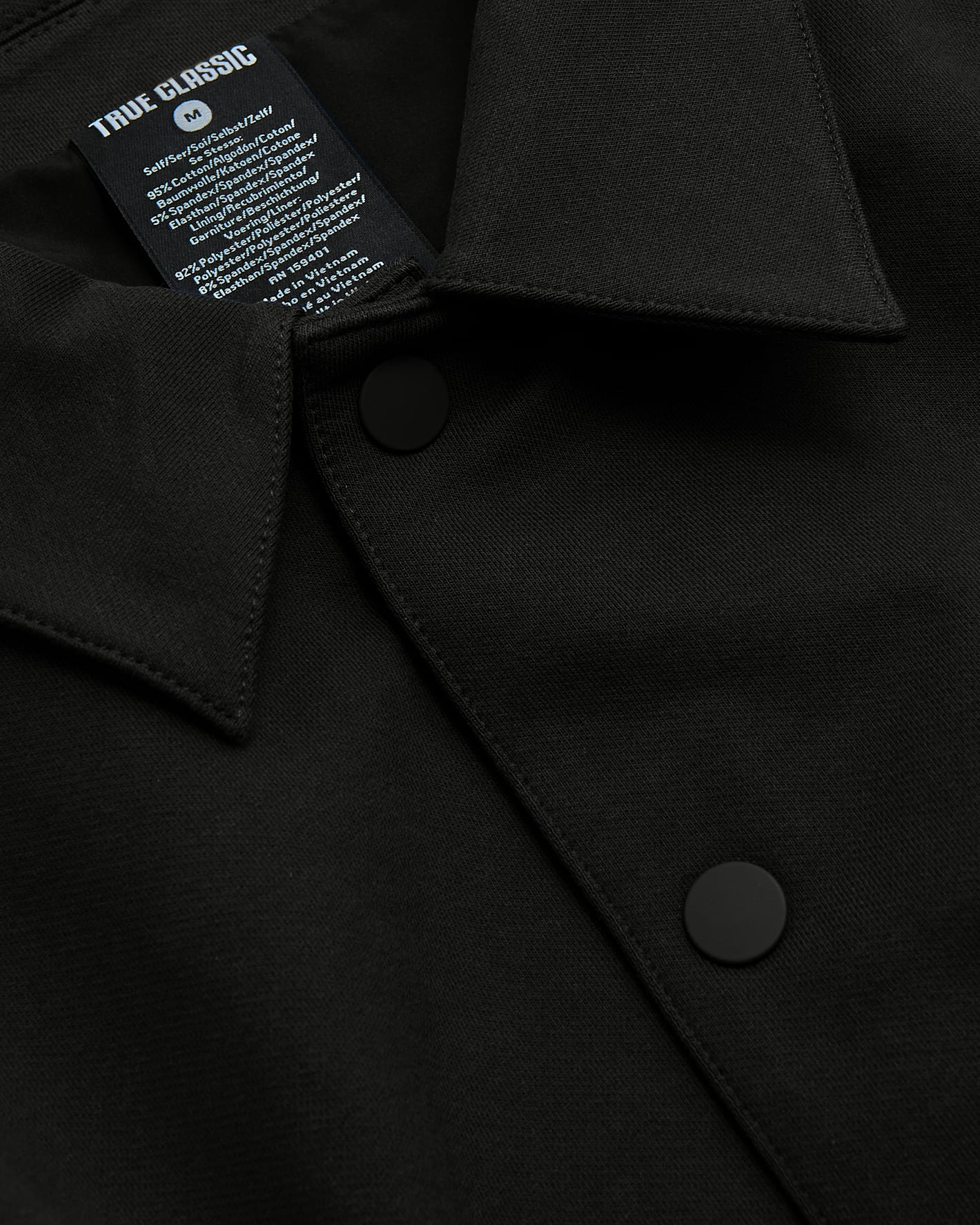 Staple Casual Jacket 3-Pack close-up: black snap-front, collared top.