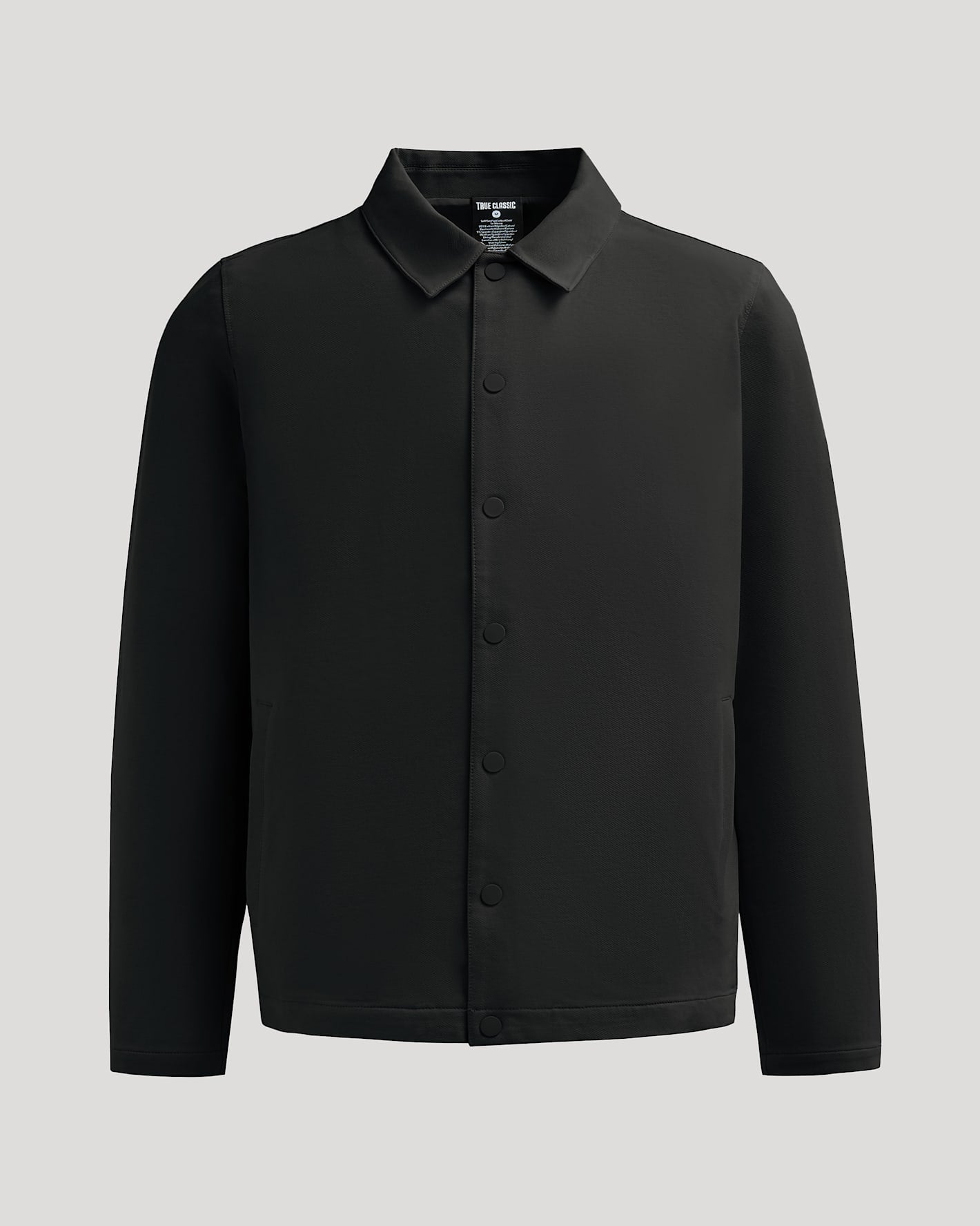 Black Casual Jacket with snap buttons, pointed collar, and discreet pockets.