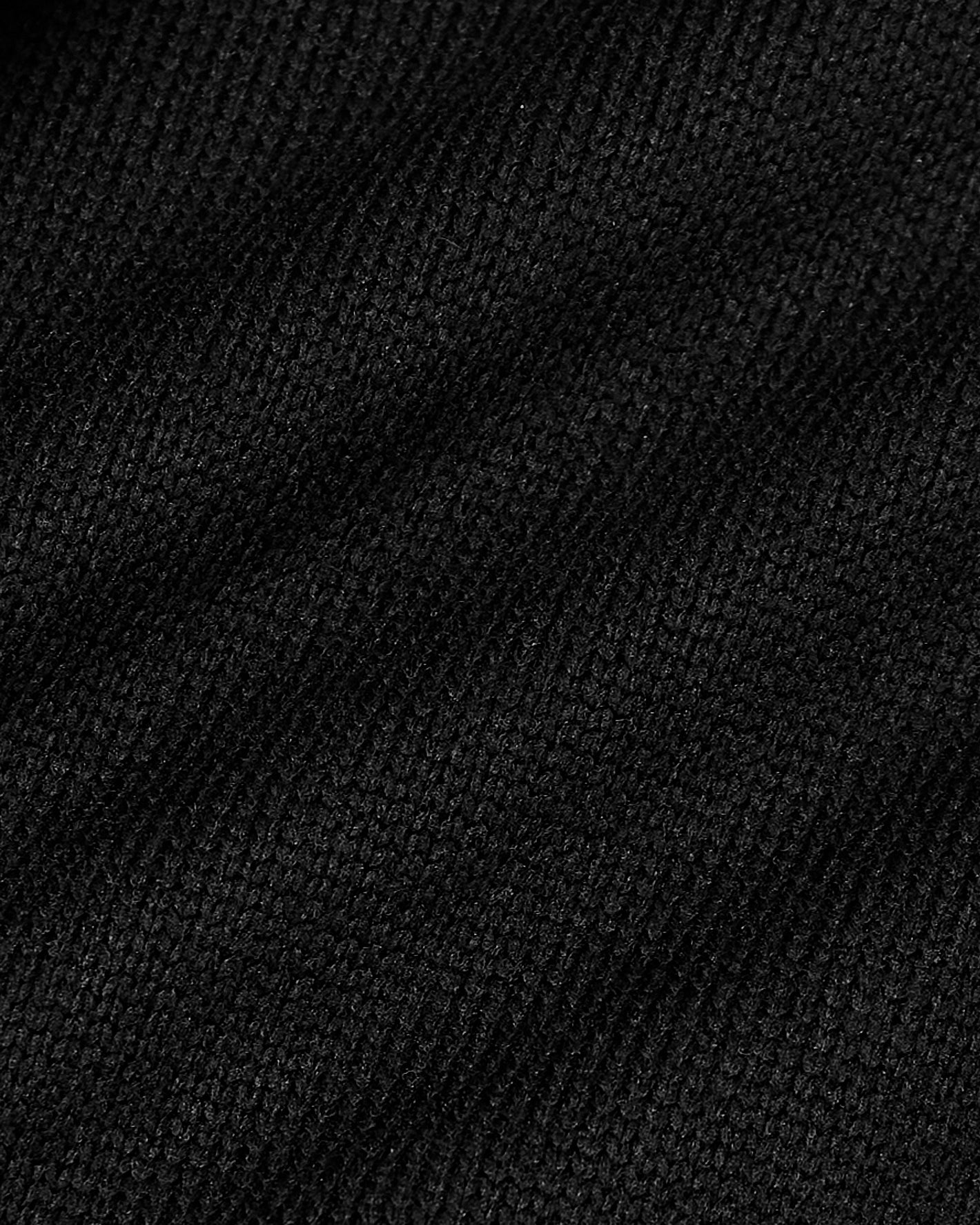 Black Sweater Fleece Jacket close-up showing fine knit texture.