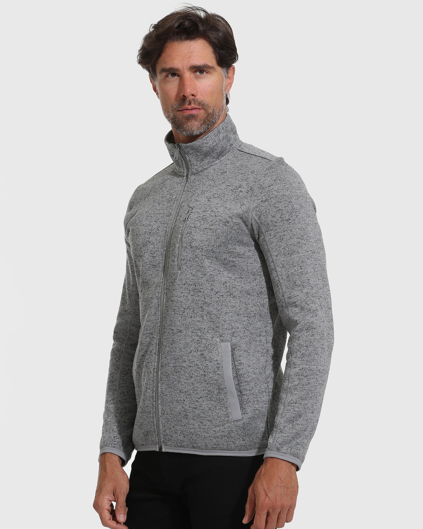 Gray Sweater Fleece Jacket on male model, showcasing zip pockets and high collar.