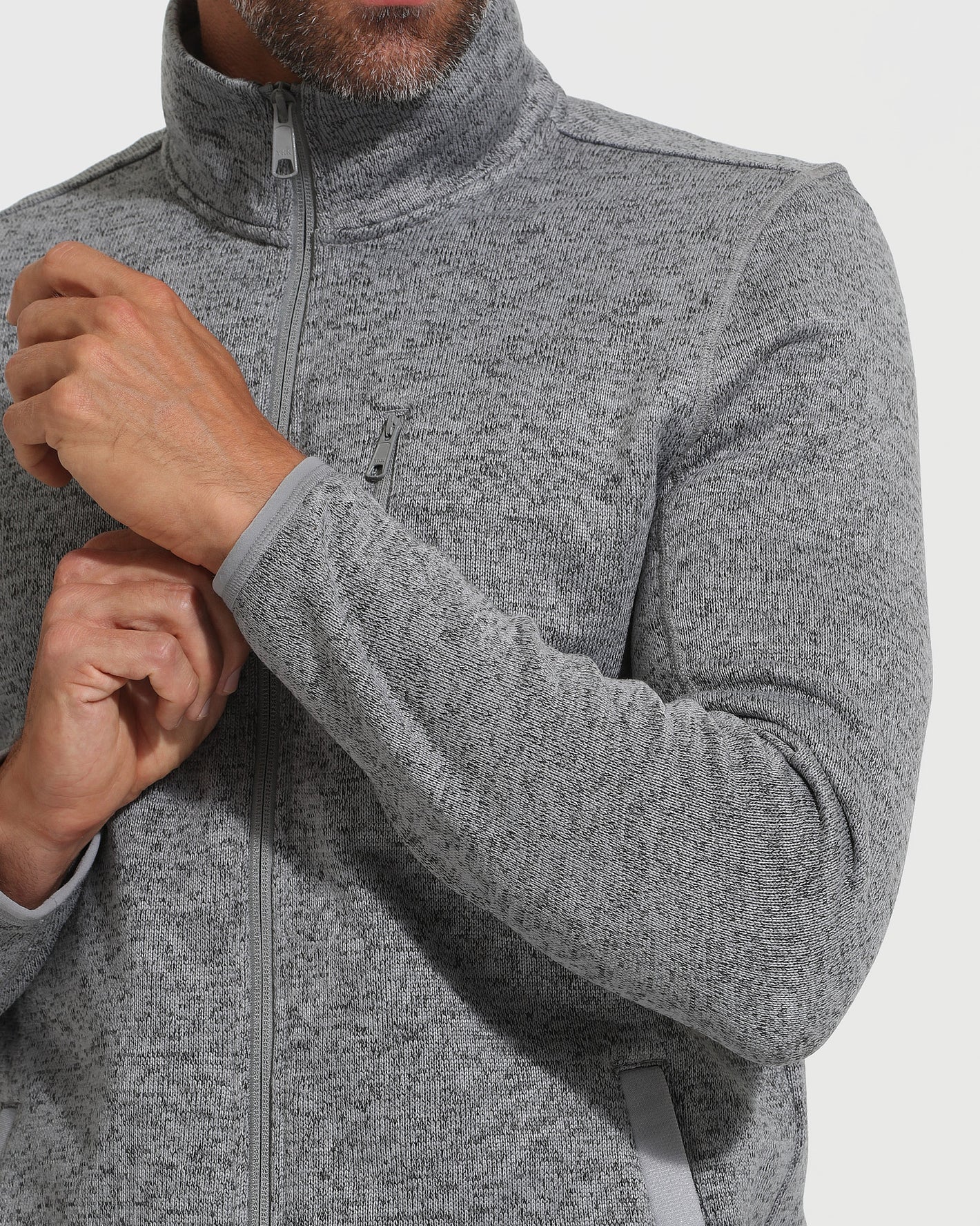 Gray Sweater Fleece Jacket with zippered chest pocket and adjustable cuff.