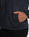 Navy Sweater Fleece Jacket with knit texture and zippered pockets.