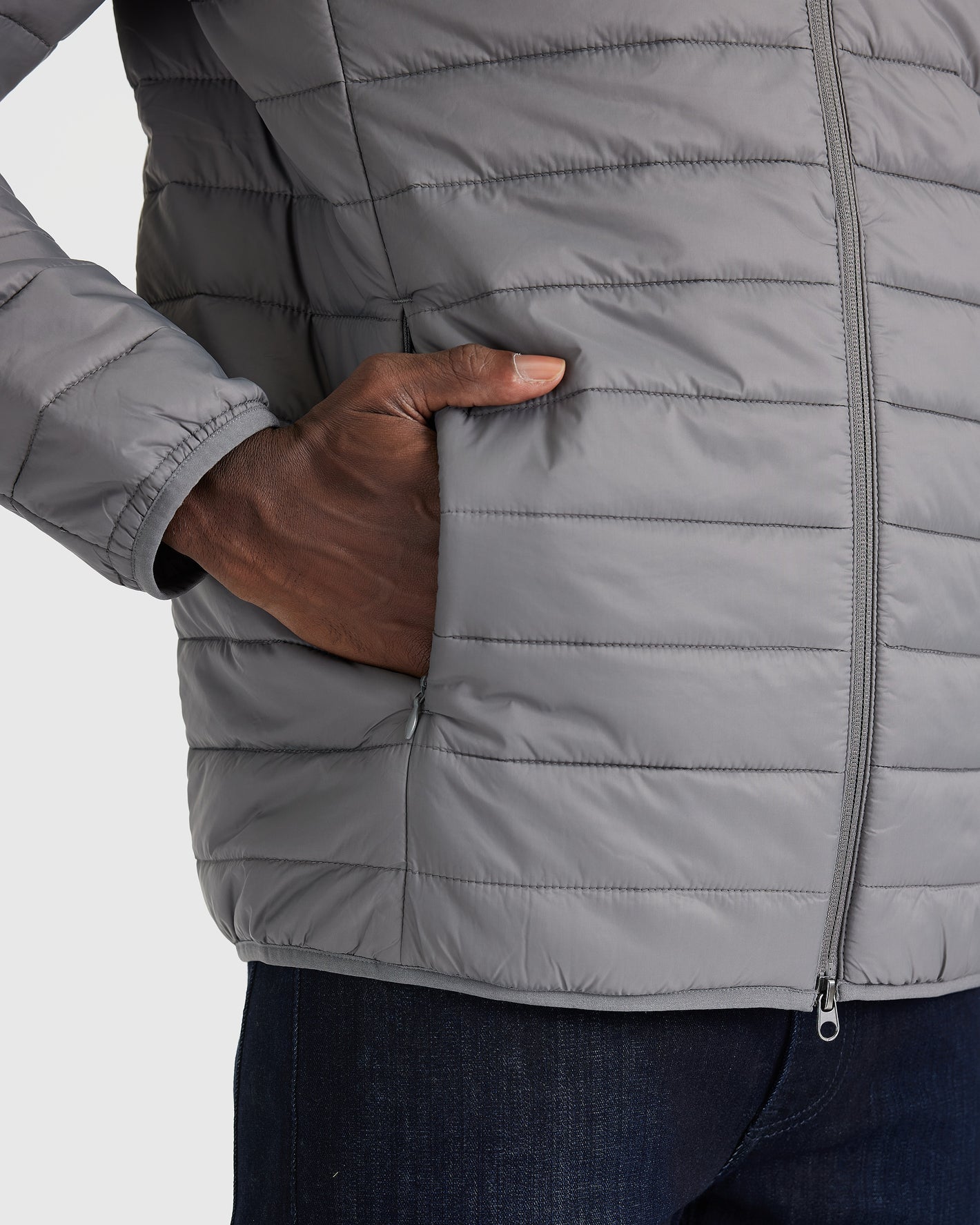 Gunmetal Puffer Jacket with quilted design and zippered pockets.
