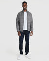 Gunmetal Puffer Jacket on smiling man in casual style.