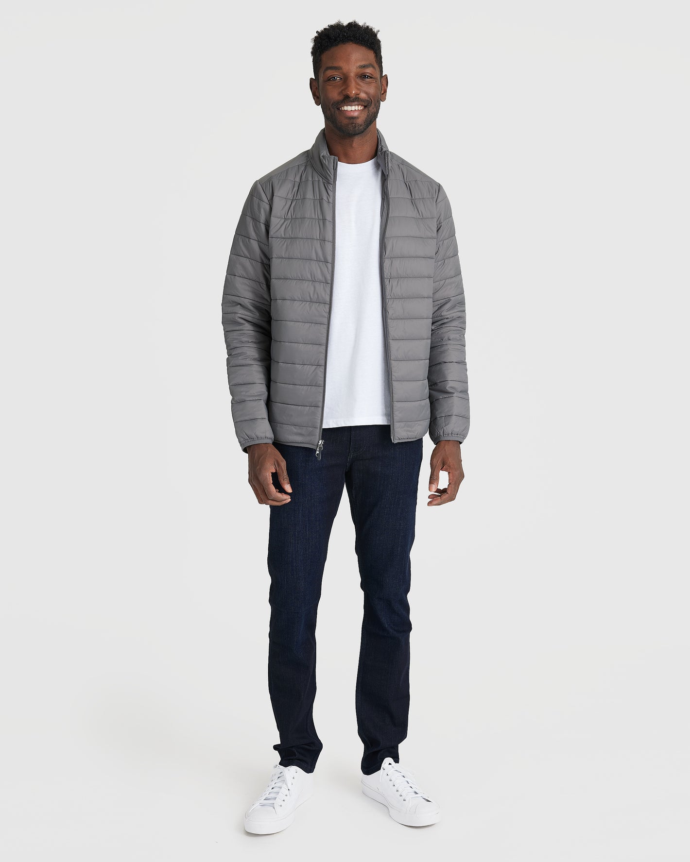 Gunmetal Puffer Jacket on smiling man in casual style.