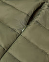 Military Green Puffer Jacket showing quilted fabric and zipper pocket.