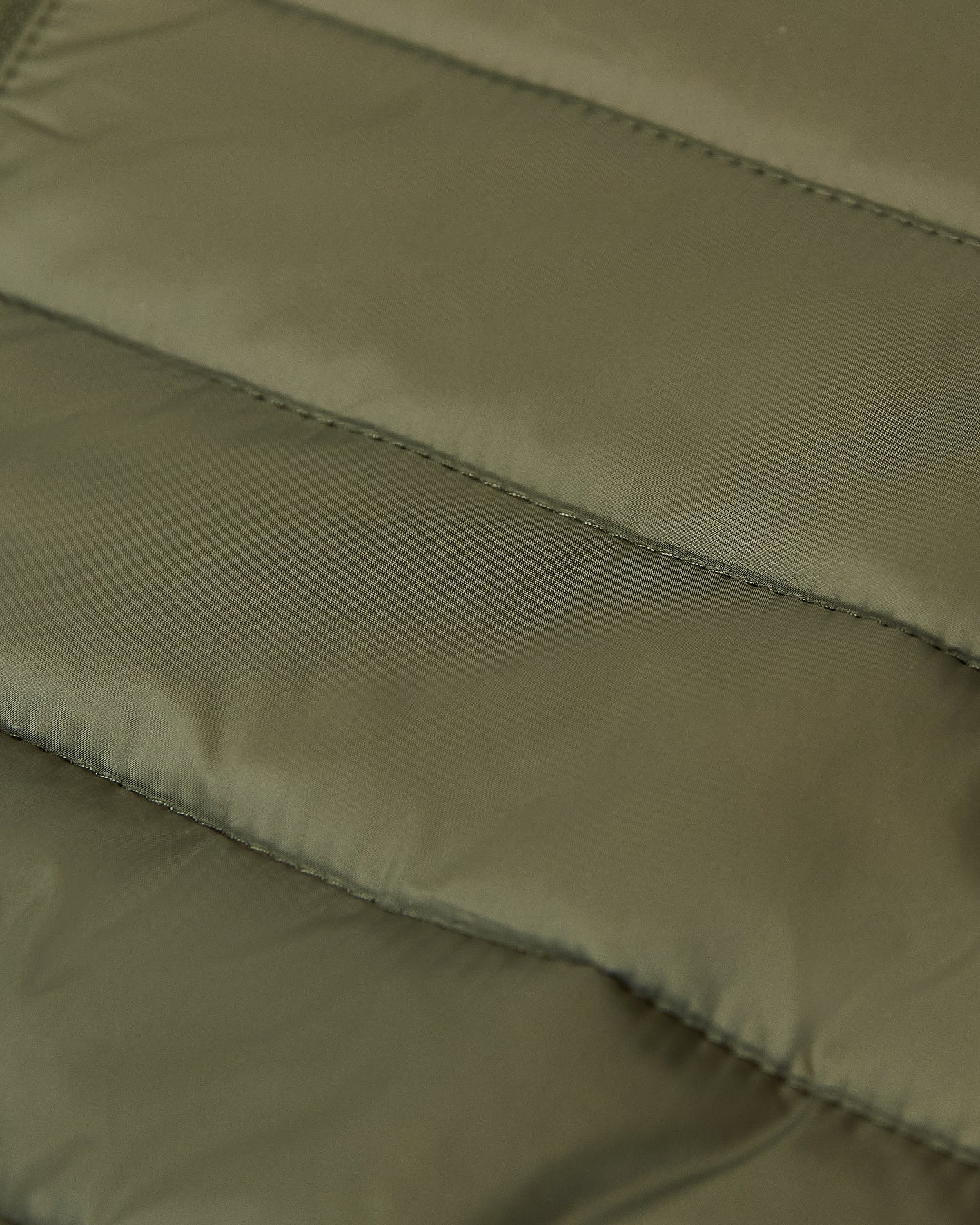 Military Green Puffer Jacket with quilted, padded panels and sleek design.