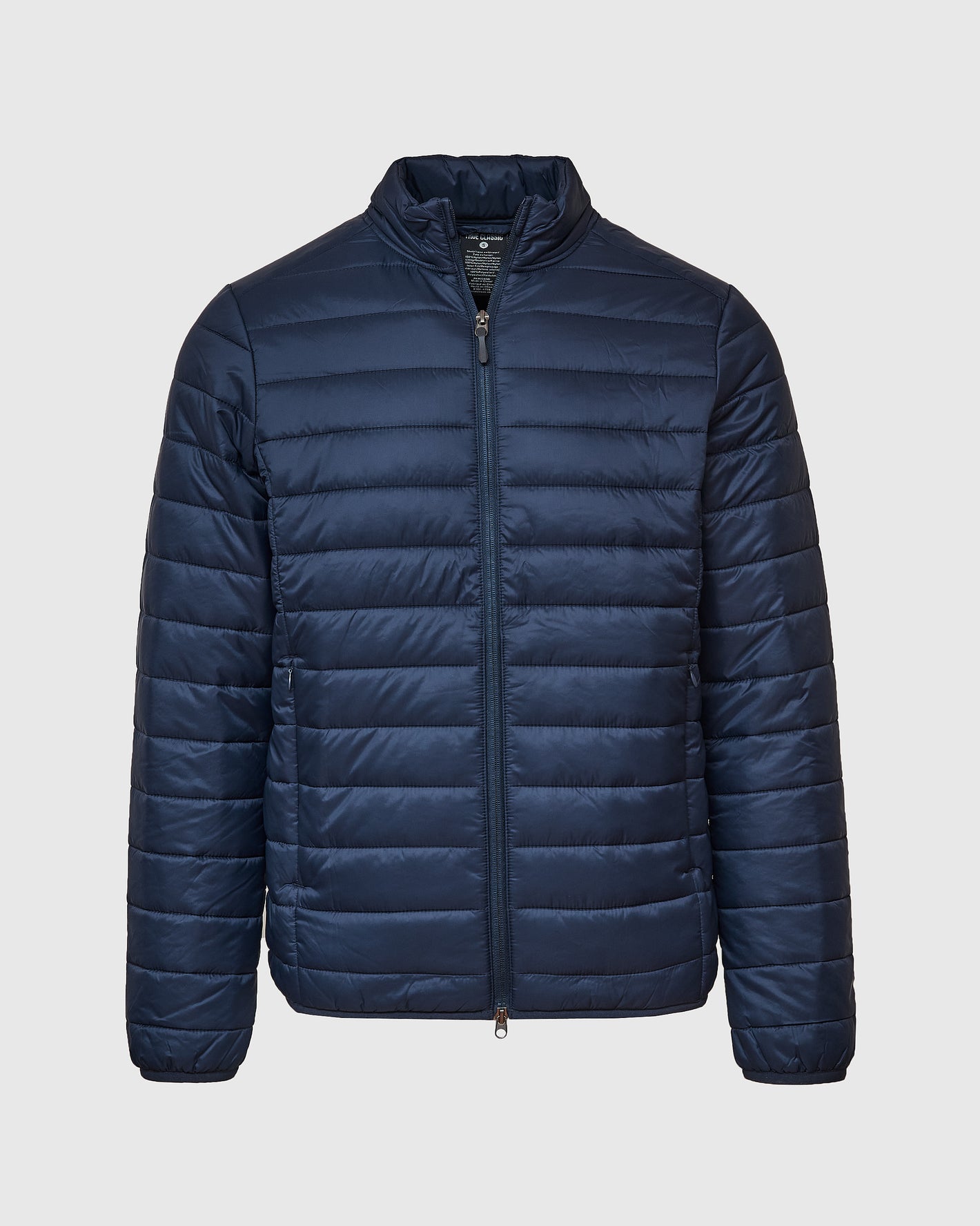 Navy Puffer Jacket with quilted design, zippered side pockets, and stand-up collar.