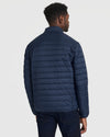 Back view of man in Navy Puffer Jacket, casual fit.