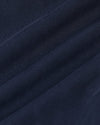 Navy Bomber Jacket fabric detail with visible weave and creases.