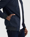 Navy Bomber Jacket with brass zipper and ribbed details.