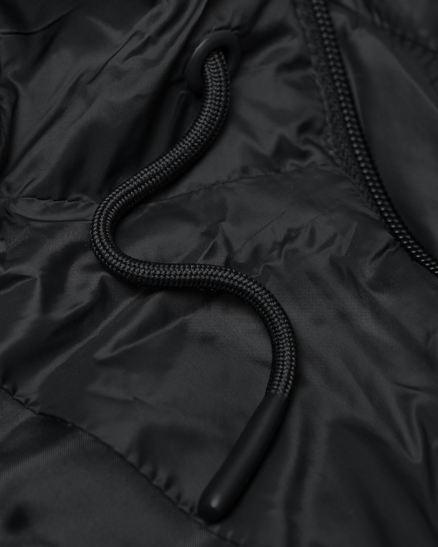 Black Hooded Puffer Jacket with braided draw-cord and visible zipper detail.