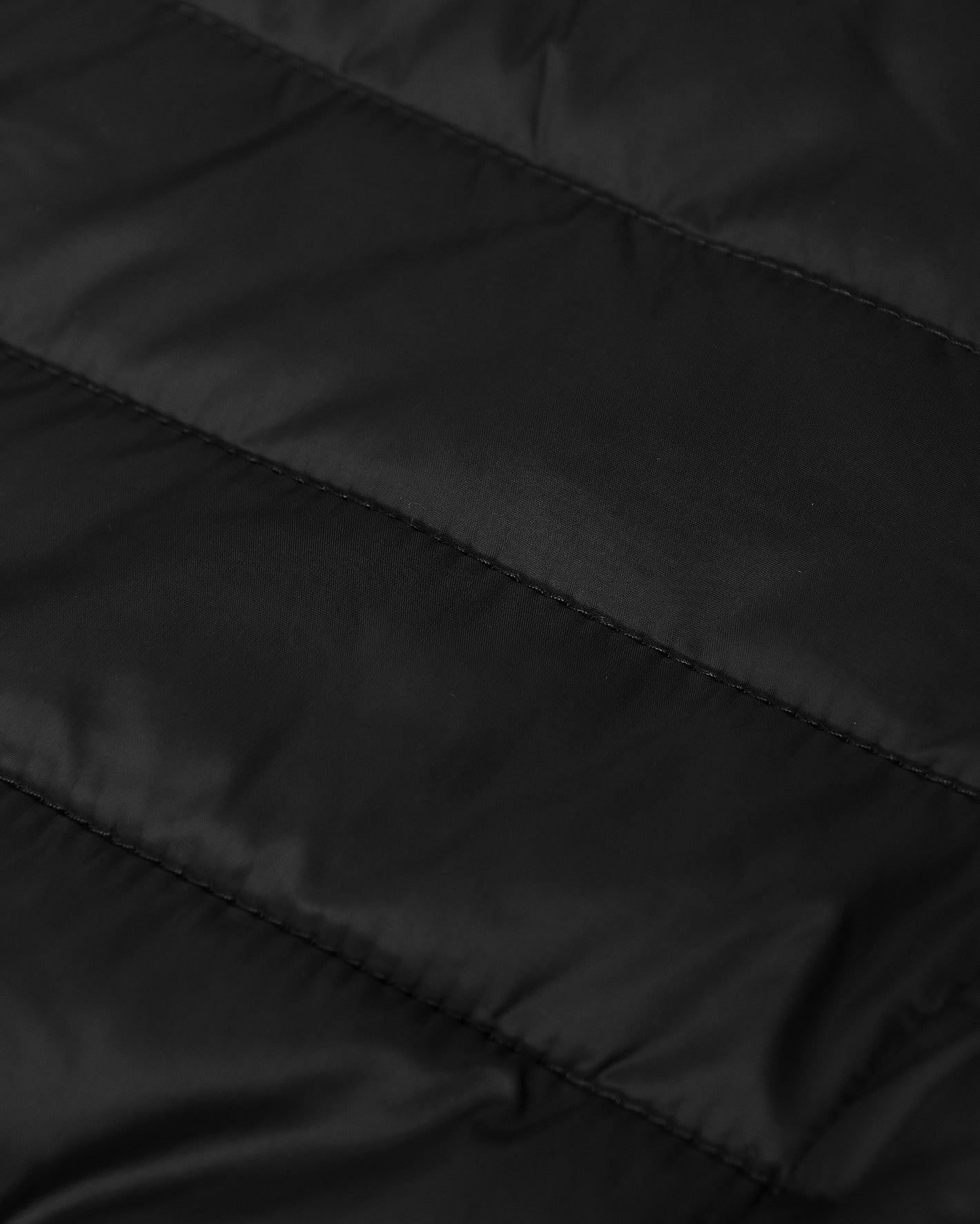 Black Hooded Puffer Jacket with quilted, shiny, horizontal-stitched fabric.