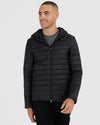 Black Hooded Puffer Jacket on male model, featuring zippered pockets and drawcord hood.