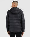 Black Hooded Puffer Jacket, back view, showcasing quilt stitching and hood.