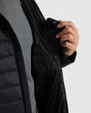 Black Hooded Puffer Jacket with interior zippered pocket holding smartphone.