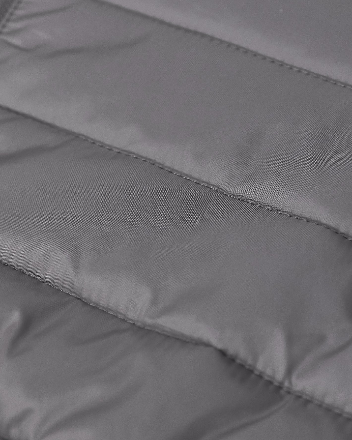 Gunmetal Hooded Puffer Jacket with quilted, insulated fabric and visible stitching.