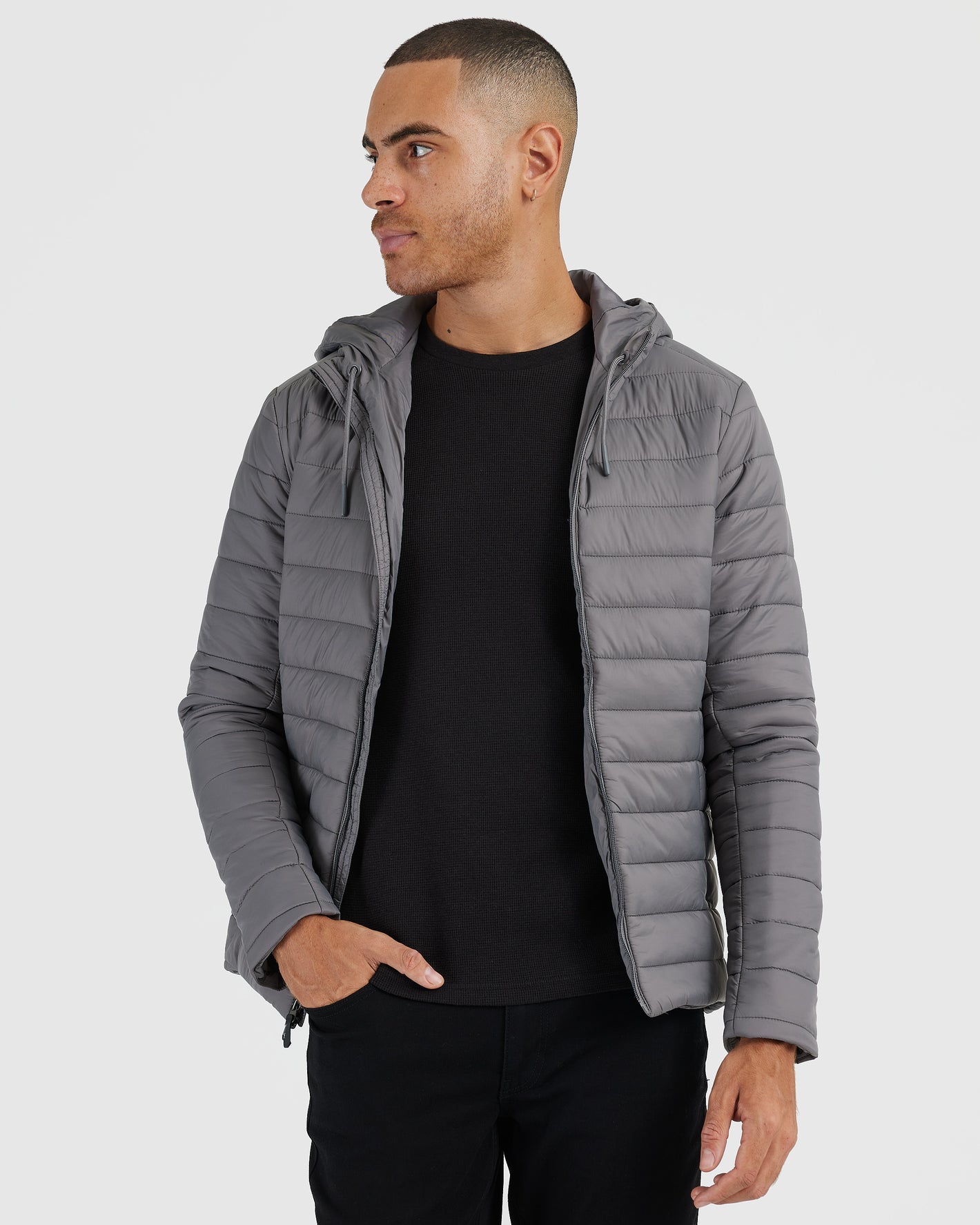 Gunmetal Hooded Puffer Jacket on male model, hands in pocket.