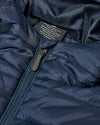 Navy Hooded Puffer Jacket with central zipper and interior label visible.