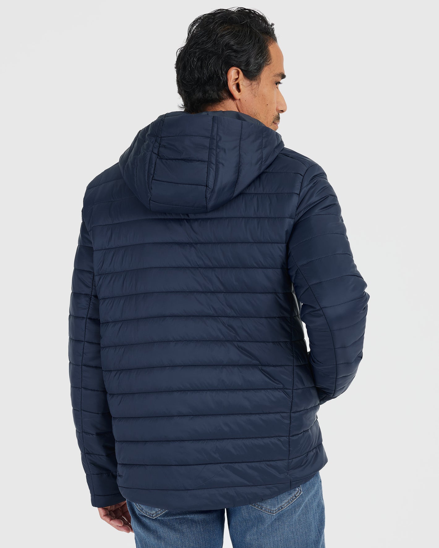 Navy Hooded Puffer Jacket with horizontal stitching, shown from the back.