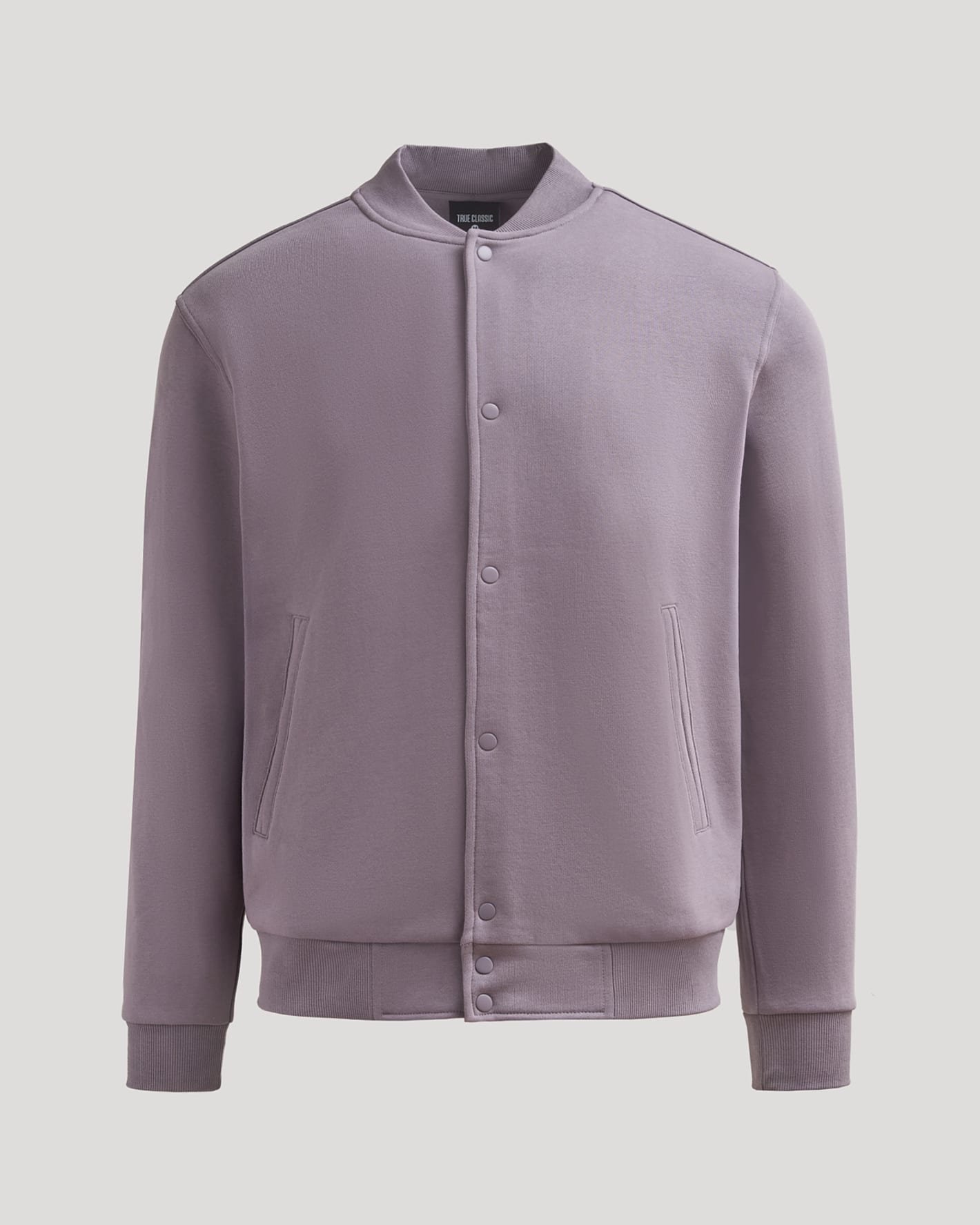 Thistle Fleece Bomber Jacket with ribbed collar and snap-button closure.