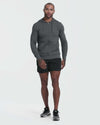 Model in Charcoal Heather Active Comfort Full Zip Hoodie, athletic shorts, running shoes.