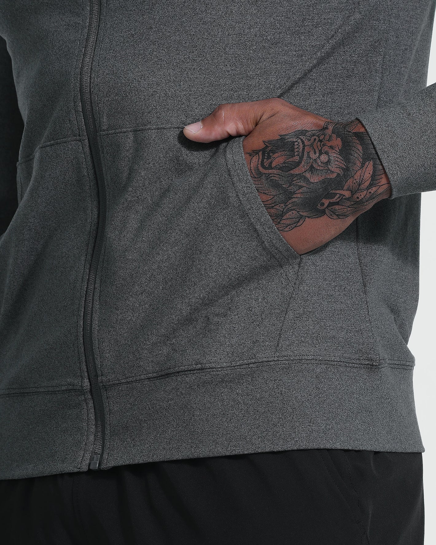 Charcoal Heather Active Comfort Full Zip Hoodie with tattooed hand in pocket.