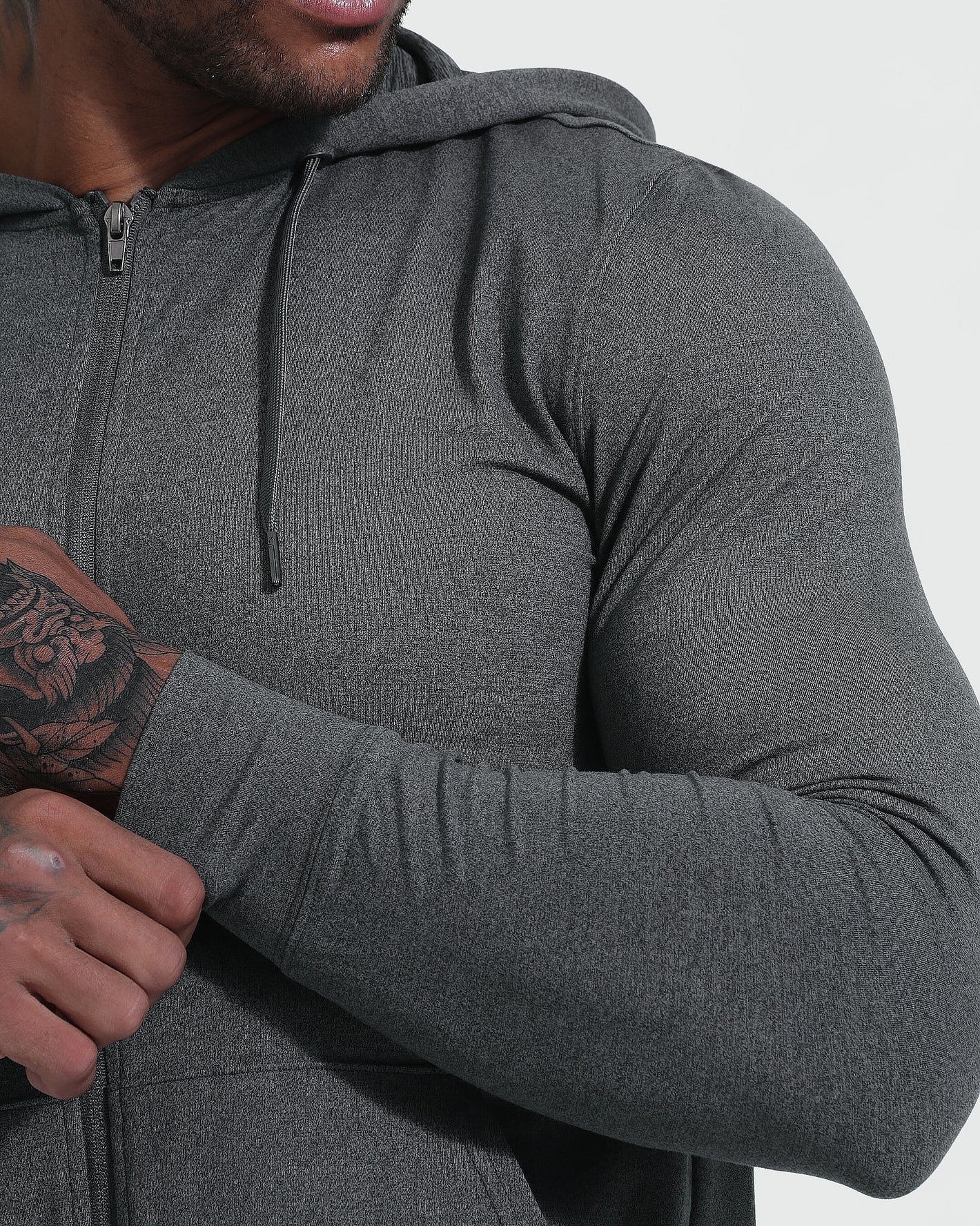 Charcoal Heather Active Comfort Full Zip Hoodie, showcasing slim fit and tattooed arm.