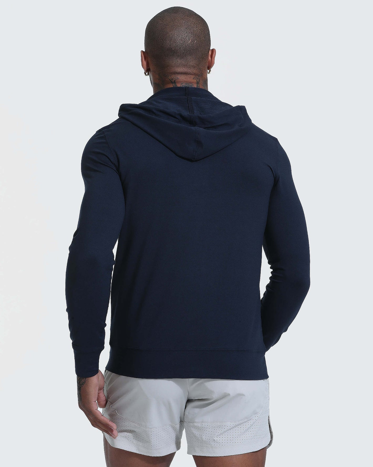 Back view of man in Dark Heather Navy Active Comfort Full Zip Hoodie.