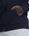 Dark Heather Navy Active Comfort Full Zip Hoodie with tattooed forearm visible.