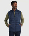Model in Navy Puffer Vest over olive waffle-knit shirt.