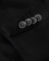 Black Comfort Knit Blazer sleeve close-up with four black buttons.