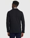 Back view of Black Comfort Knit Blazer over white-collared shirt.